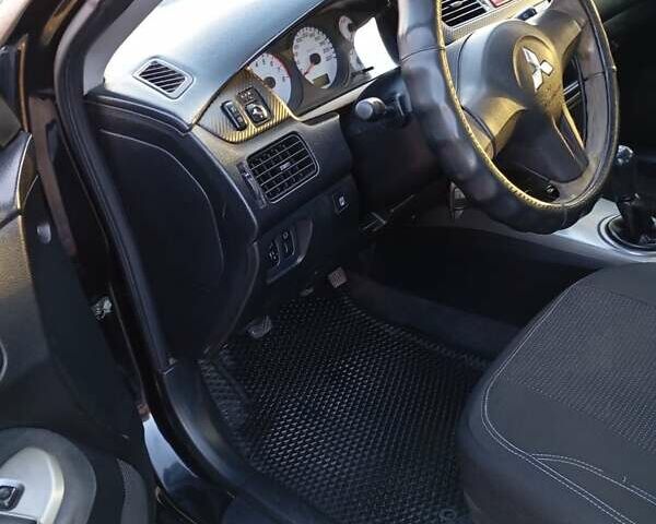 Чорний Міцубісі Lancer, об'ємом двигуна 1.6 л та пробігом 325 тис. км за 4750 $, фото 13 на Automoto.ua