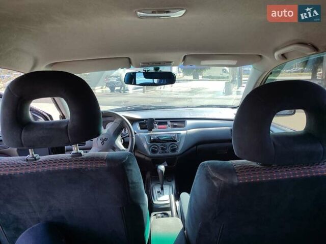 Чорний Міцубісі Lancer, об'ємом двигуна 1.58 л та пробігом 128 тис. км за 4600 $, фото 11 на Automoto.ua