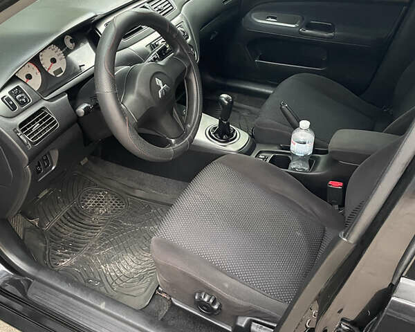 Чорний Міцубісі Lancer, об'ємом двигуна 1.6 л та пробігом 240 тис. км за 4599 $, фото 10 на Automoto.ua