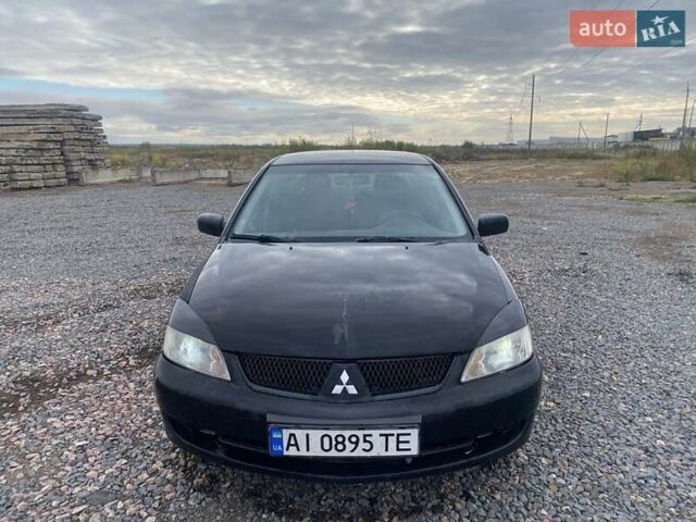 Чорний Міцубісі Lancer, об'ємом двигуна 1.6 л та пробігом 335 тис. км за 3500 $, фото 10 на Automoto.ua