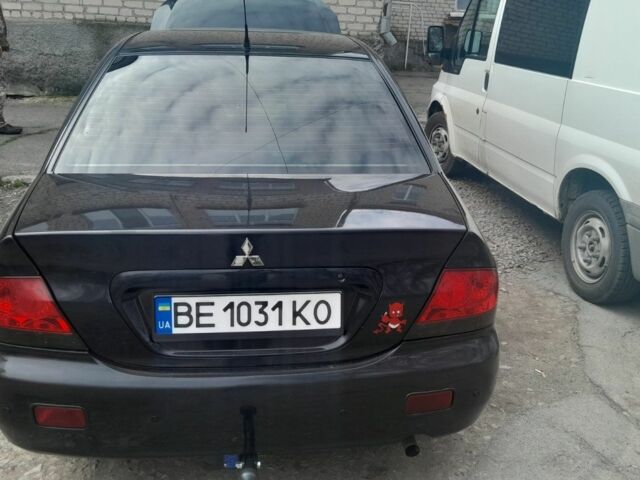 Черный Мицубиси Лансер, объемом двигателя 1.6 л и пробегом 260 тыс. км за 3800 $, фото 5 на Automoto.ua