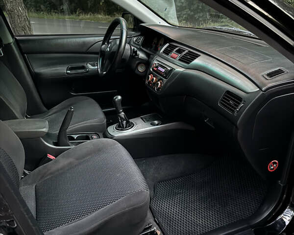 Чорний Міцубісі Lancer, об'ємом двигуна 1.6 л та пробігом 375 тис. км за 4500 $, фото 12 на Automoto.ua