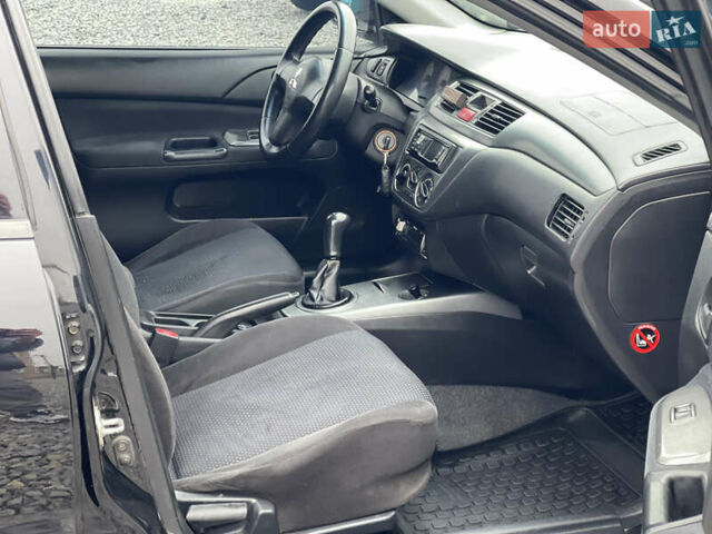 Чорний Міцубісі Lancer, об'ємом двигуна 1.58 л та пробігом 230 тис. км за 3350 $, фото 18 на Automoto.ua