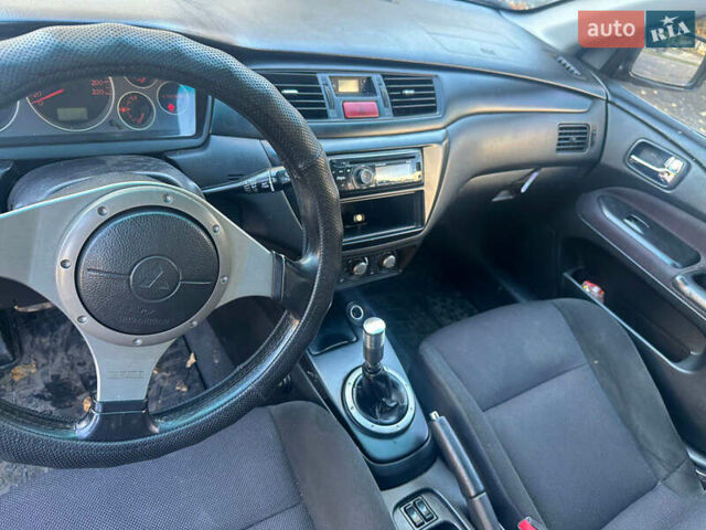 Чорний Міцубісі Lancer, об'ємом двигуна 2 л та пробігом 270 тис. км за 3300 $, фото 7 на Automoto.ua