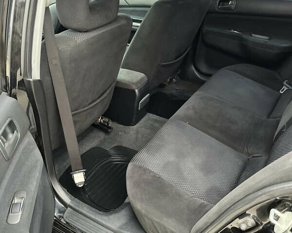 Чорний Міцубісі Lancer, об'ємом двигуна 1.58 л та пробігом 230 тис. км за 3350 $, фото 9 на Automoto.ua