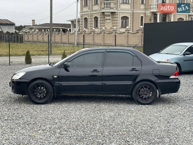 Чорний Міцубісі Lancer, об'ємом двигуна 1.58 л та пробігом 230 тис. км за 3350 $, фото 12 на Automoto.ua