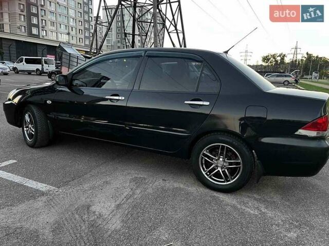 Чорний Міцубісі Lancer, об'ємом двигуна 1.58 л та пробігом 329 тис. км за 3500 $, фото 5 на Automoto.ua