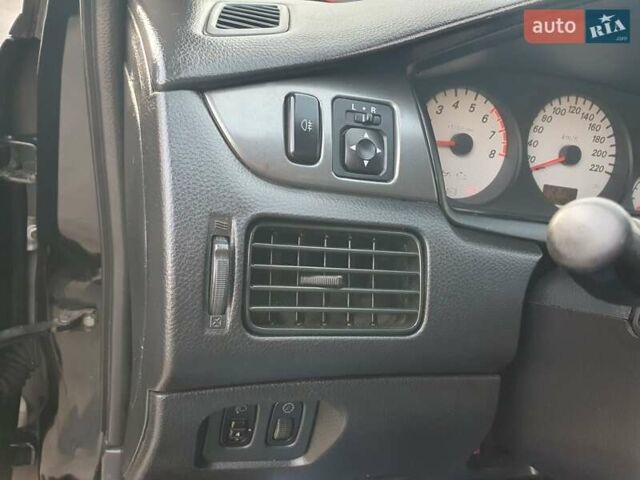 Черный Мицубиси Лансер, объемом двигателя 1.58 л и пробегом 222 тыс. км за 2999 $, фото 18 на Automoto.ua