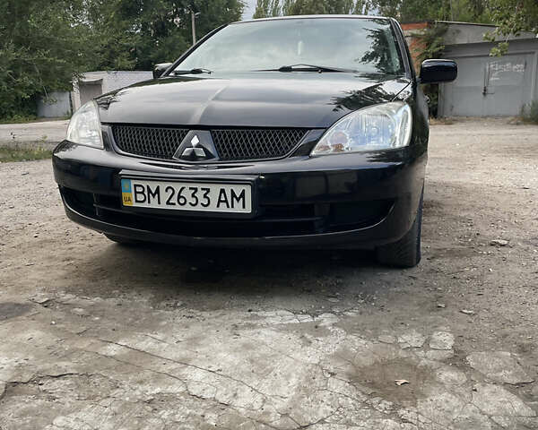 Чорний Міцубісі Lancer, об'ємом двигуна 1.6 л та пробігом 240 тис. км за 4599 $, фото 1 на Automoto.ua