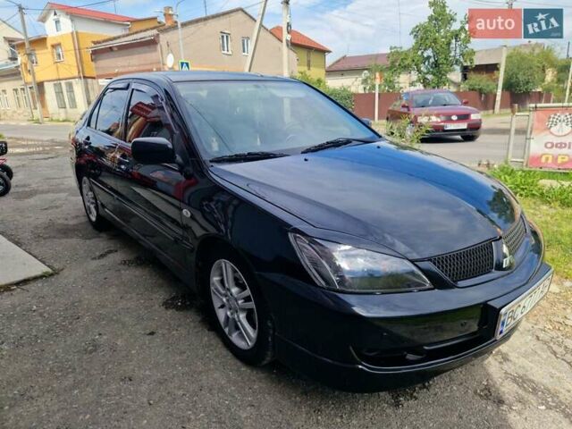 Черный Мицубиси Лансер, объемом двигателя 2 л и пробегом 168 тыс. км за 4999 $, фото 3 на Automoto.ua