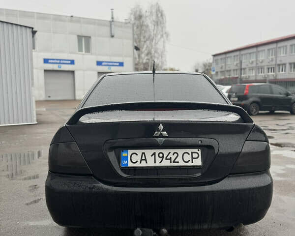 Черный Мицубиси Лансер, объемом двигателя 1.6 л и пробегом 368 тыс. км за 3200 $, фото 4 на Automoto.ua