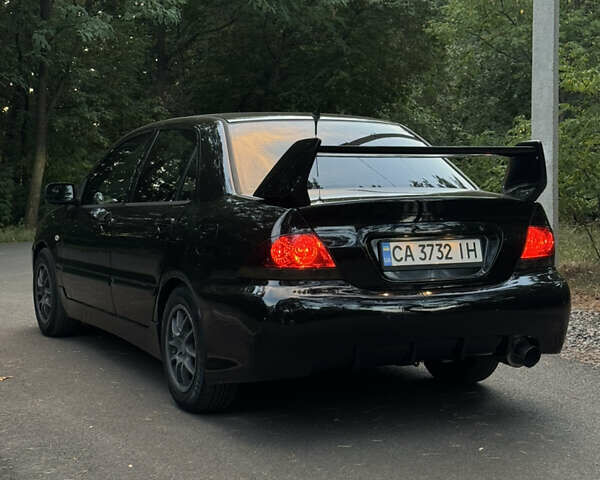 Чорний Міцубісі Lancer, об'ємом двигуна 1.6 л та пробігом 375 тис. км за 4500 $, фото 8 на Automoto.ua