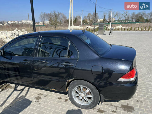 Черный Мицубиси Лансер, объемом двигателя 1.6 л и пробегом 220 тыс. км за 4200 $, фото 7 на Automoto.ua