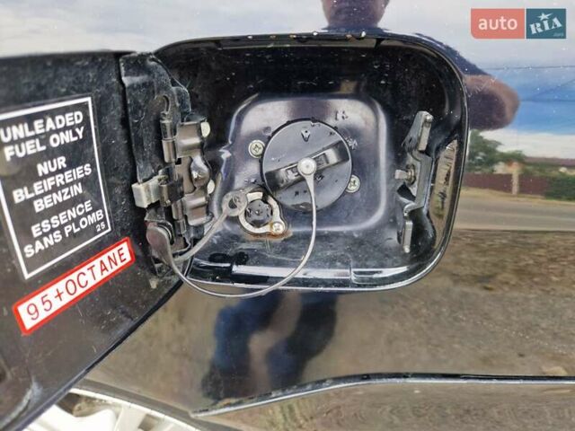 Черный Мицубиси Лансер, объемом двигателя 2 л и пробегом 168 тыс. км за 4999 $, фото 2 на Automoto.ua