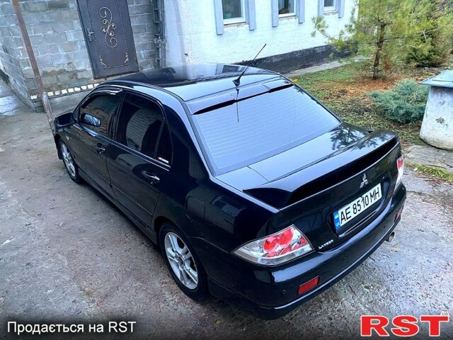 Чорний Міцубісі Lancer, об'ємом двигуна 2 л та пробігом 347 тис. км за 5200 $, фото 1 на Automoto.ua