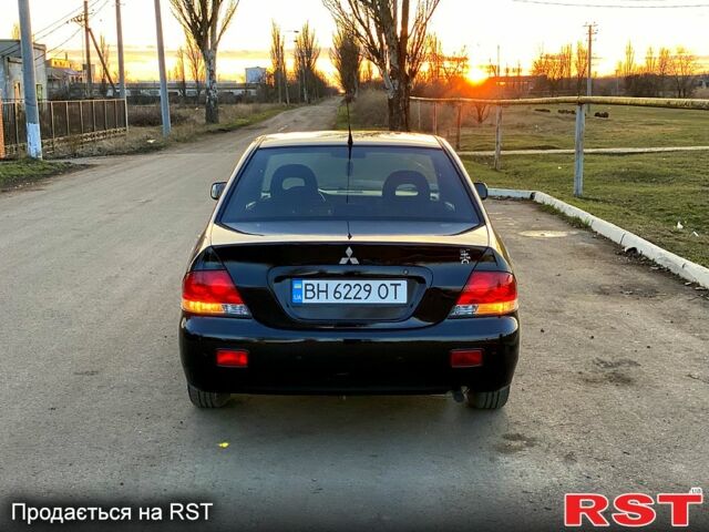 Чорний Міцубісі Lancer, об'ємом двигуна 1.6 л та пробігом 162 тис. км за 4999 $, фото 5 на Automoto.ua