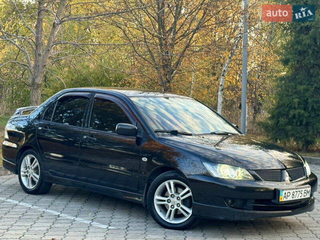 Міцубісі Lancer 2006 у Дніпро (Дніпропетровську) на Automoto.ua Чорний Міцубісі Lancer, об'ємом двигуна 2 л та пробігом 230 тис. км за 4900 $, фото 6 на Automoto.ua