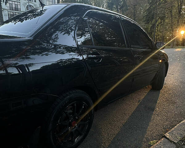 Черный Мицубиси Лансер, объемом двигателя 1.6 л и пробегом 233 тыс. км за 3650 $, фото 5 на Automoto.ua