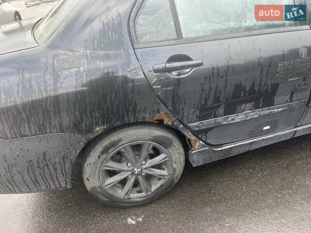 Чорний Міцубісі Lancer, об'ємом двигуна 1.58 л та пробігом 257 тис. км за 2400 $, фото 3 на Automoto.ua