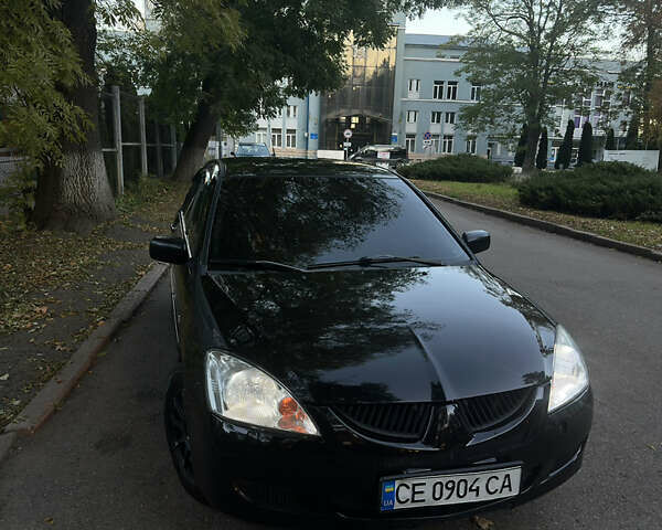 Черный Мицубиси Лансер, объемом двигателя 1.6 л и пробегом 233 тыс. км за 3650 $, фото 9 на Automoto.ua