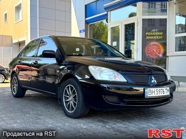 Чорний Міцубісі Lancer, об'ємом двигуна 1.6 л та пробігом 176 тис. км за 3777 $, фото 1 на Automoto.ua