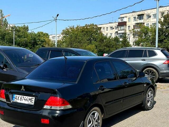 Черный Мицубиси Лансер, объемом двигателя 1.6 л и пробегом 230 тыс. км за 3200 $, фото 3 на Automoto.ua