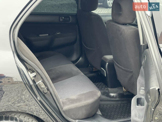 Чорний Міцубісі Lancer, об'ємом двигуна 1.58 л та пробігом 230 тис. км за 3350 $, фото 21 на Automoto.ua