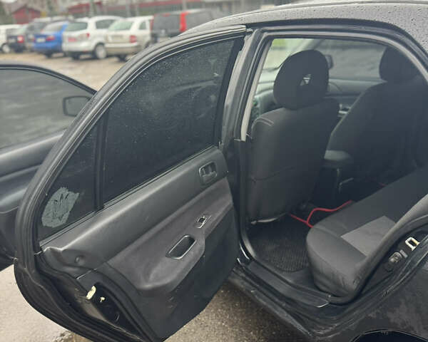 Черный Мицубиси Лансер, объемом двигателя 1.6 л и пробегом 368 тыс. км за 3200 $, фото 8 на Automoto.ua