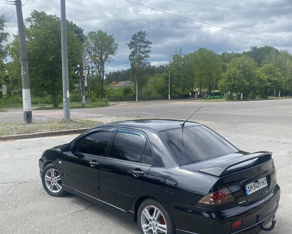 Чорний Міцубісі Lancer, об'ємом двигуна 2 л та пробігом 183 тис. км за 4500 $, фото 5 на Automoto.ua