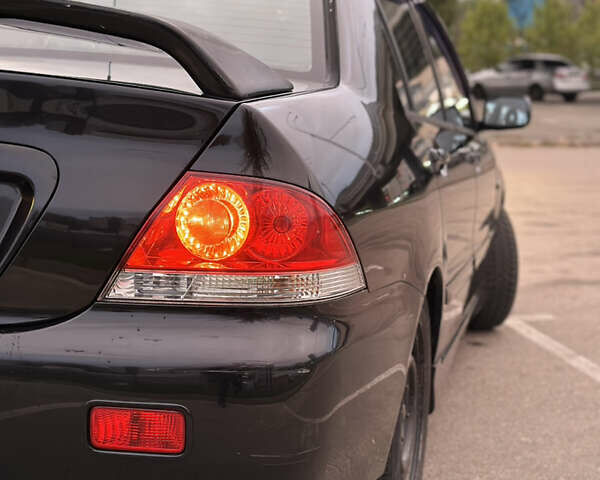 Чорний Міцубісі Lancer, об'ємом двигуна 1.58 л та пробігом 230 тис. км за 4350 $, фото 7 на Automoto.ua