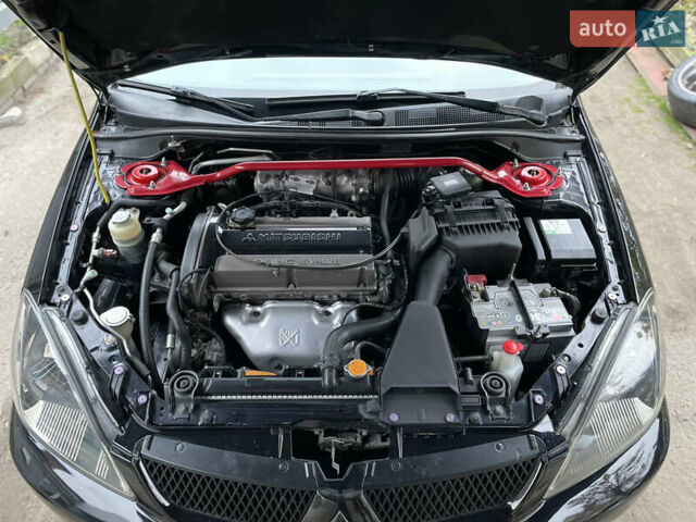 Чорний Міцубісі Lancer, об'ємом двигуна 2 л та пробігом 242 тис. км за 5900 $, фото 8 на Automoto.ua