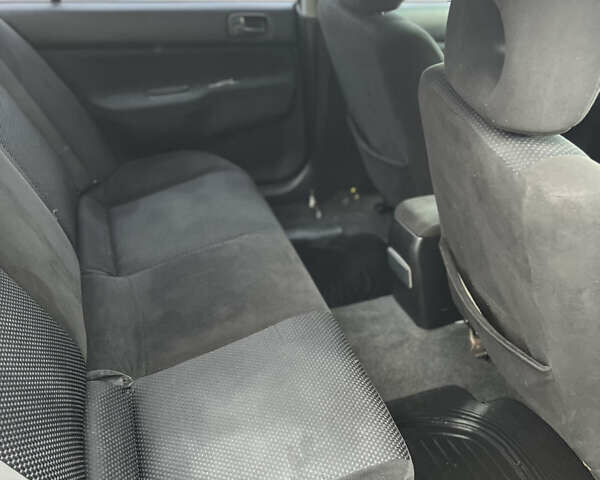 Чорний Міцубісі Lancer, об'ємом двигуна 1.58 л та пробігом 230 тис. км за 3350 $, фото 6 на Automoto.ua