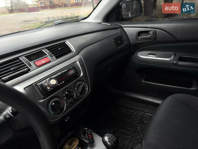 Чорний Міцубісі Lancer, об'ємом двигуна 1.58 л та пробігом 210 тис. км за 3900 $, фото 12 на Automoto.ua
