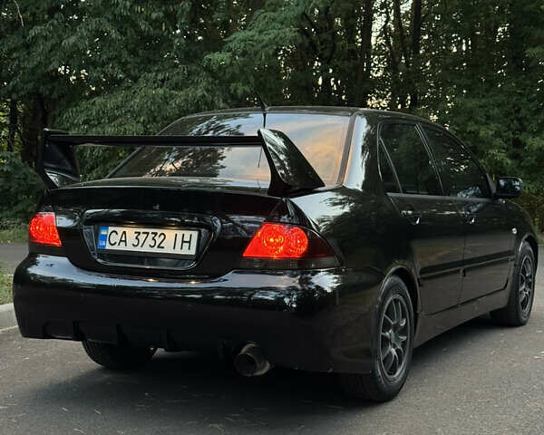 Чорний Міцубісі Lancer, об'ємом двигуна 1.6 л та пробігом 375 тис. км за 4500 $, фото 5 на Automoto.ua