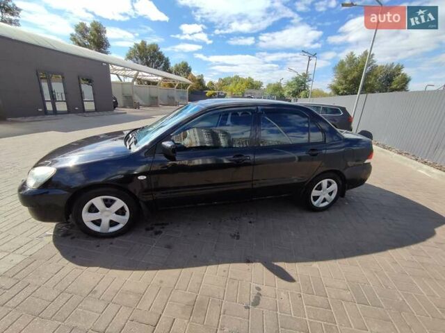 Чорний Міцубісі Lancer, об'ємом двигуна 1.58 л та пробігом 128 тис. км за 4600 $, фото 3 на Automoto.ua