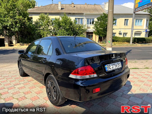 Черный Мицубиси Лансер, объемом двигателя 1.6 л и пробегом 300 тыс. км за 3599 $, фото 7 на Automoto.ua