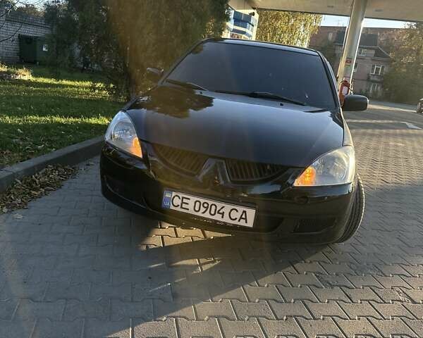 Черный Мицубиси Лансер, объемом двигателя 1.58 л и пробегом 230 тыс. км за 3800 $, фото 18 на Automoto.ua