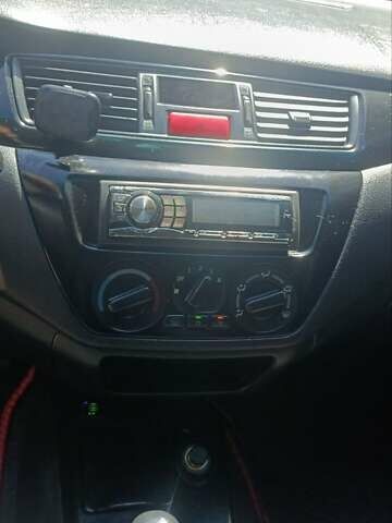 Чорний Міцубісі Lancer, об'ємом двигуна 1.6 л та пробігом 240 тис. км за 3900 $, фото 8 на Automoto.ua