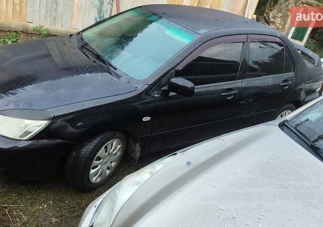 Чорний Міцубісі Lancer, об'ємом двигуна 1.58 л та пробігом 180 тис. км за 5000 $, фото 3 на Automoto.ua