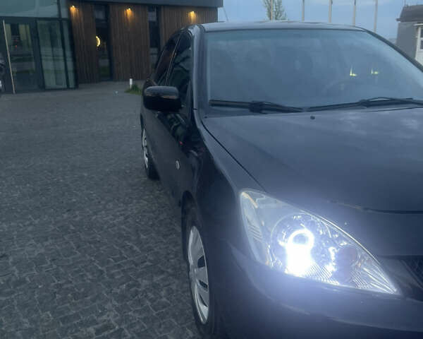 Черный Мицубиси Лансер, объемом двигателя 1.6 л и пробегом 231 тыс. км за 4250 $, фото 2 на Automoto.ua