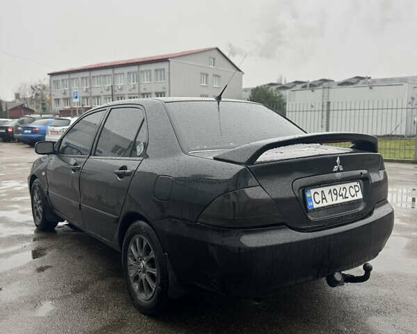 Черный Мицубиси Лансер, объемом двигателя 1.6 л и пробегом 368 тыс. км за 3200 $, фото 5 на Automoto.ua