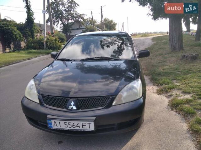 Чорний Міцубісі Lancer, об'ємом двигуна 1.58 л та пробігом 520 тис. км за 3400 $, фото 5 на Automoto.ua