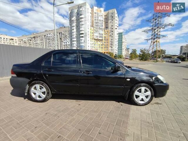 Чорний Міцубісі Lancer, об'ємом двигуна 1.58 л та пробігом 128 тис. км за 4600 $, фото 29 на Automoto.ua