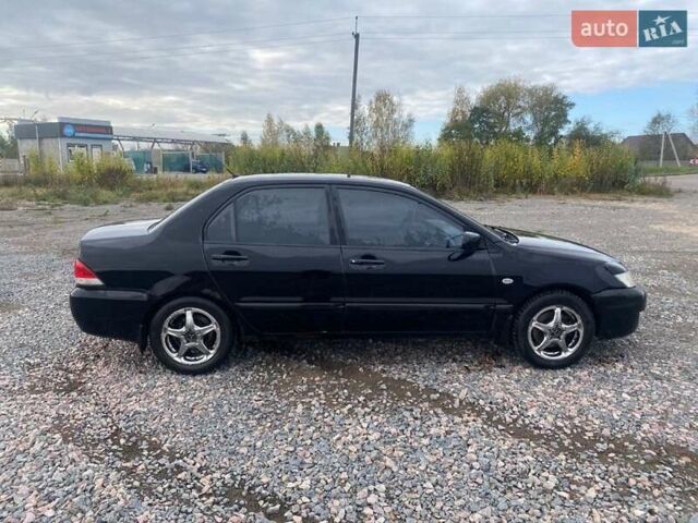 Чорний Міцубісі Lancer, об'ємом двигуна 1.6 л та пробігом 335 тис. км за 3500 $, фото 4 на Automoto.ua
