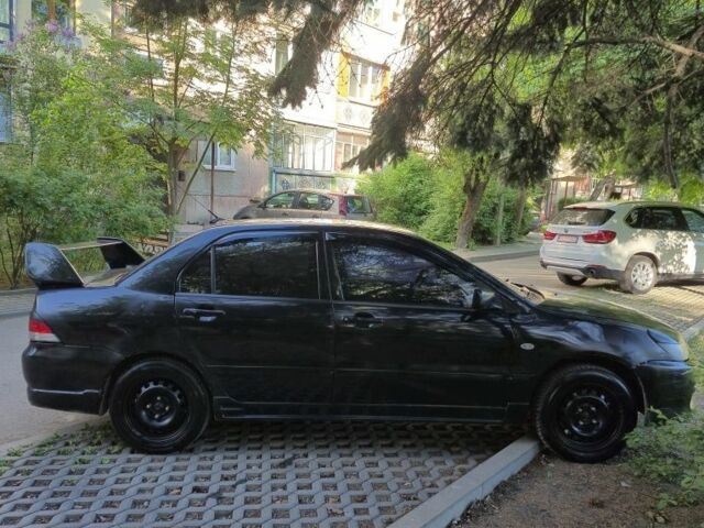 Чорний Міцубісі Lancer, об'ємом двигуна 1.6 л та пробігом 260 тис. км за 2500 $, фото 1 на Automoto.ua
