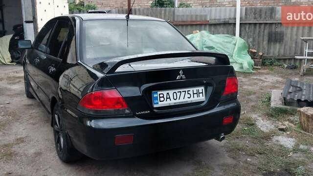 Чорний Міцубісі Lancer, об'ємом двигуна 1.59 л та пробігом 185 тис. км за 4900 $, фото 10 на Automoto.ua