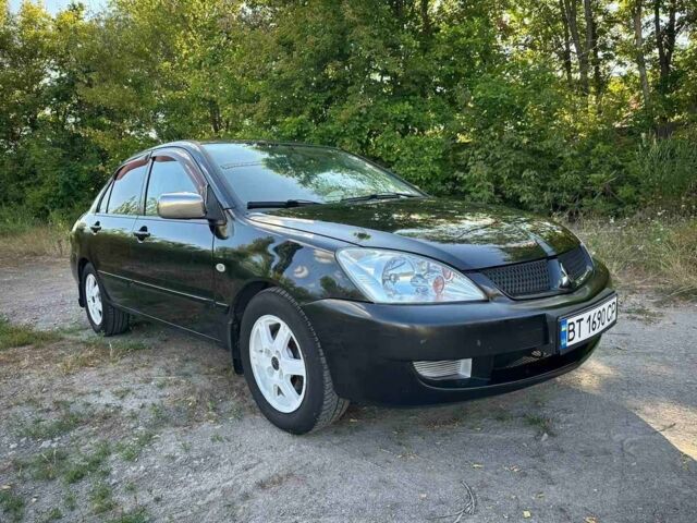 Черный Мицубиси Лансер, объемом двигателя 1.6 л и пробегом 289 тыс. км за 3200 $, фото 12 на Automoto.ua