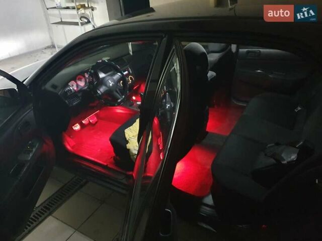 Чорний Міцубісі Lancer, об'ємом двигуна 1.58 л та пробігом 222 тис. км за 2999 $, фото 7 на Automoto.ua