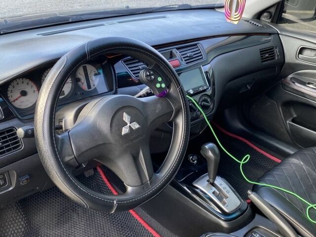 Черный Мицубиси Лансер, объемом двигателя 1.6 л и пробегом 200 тыс. км за 3400 $, фото 4 на Automoto.ua