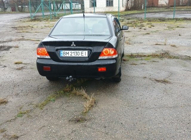 Черный Мицубиси Лансер, объемом двигателя 1.6 л и пробегом 230 тыс. км за 3250 $, фото 2 на Automoto.ua